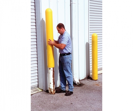 Yellow bollard cover being inserted