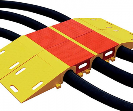 Diamond back hose protector ramps put together with wires and connectors tunneling throught the ramp