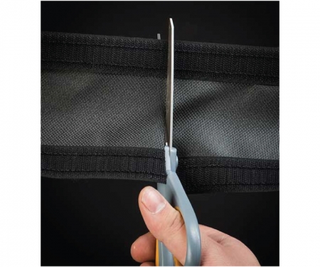 Durarace cord cover being cut with scissors Durarace cord cover being cut with scissors