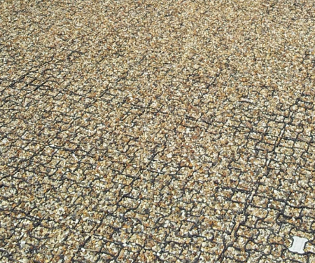 Geogrid permeable paving tile in use with gravel fully filled with gravel Geogrid permeable paving tile in use with gravel fully filled with gravel