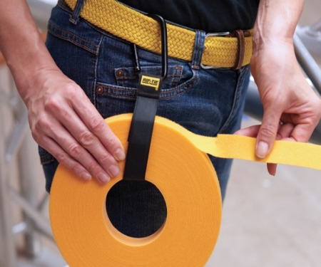 Heavy duty cable carrier strap attached to tool belt