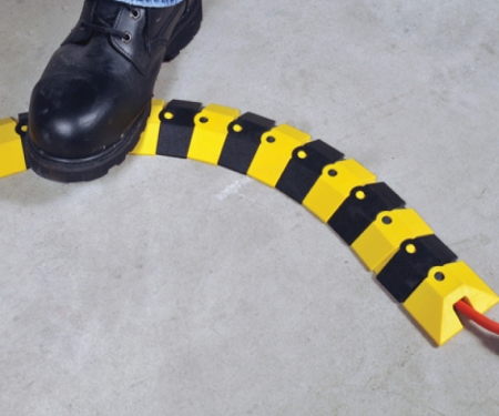 Bendable Sidewinder cord cover in use