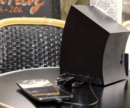 Black TeleCharger Multi-Device Charging Station in use