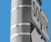 stainless steel banding straps close up in use on pole with street signs